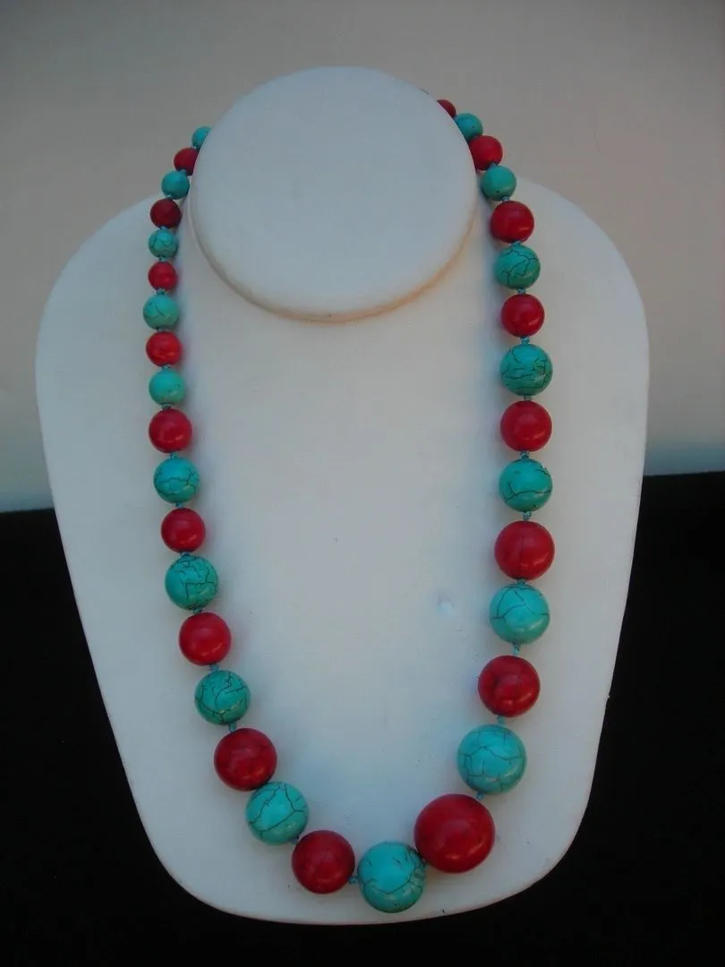 Red and turquoise beaded necklace on display.