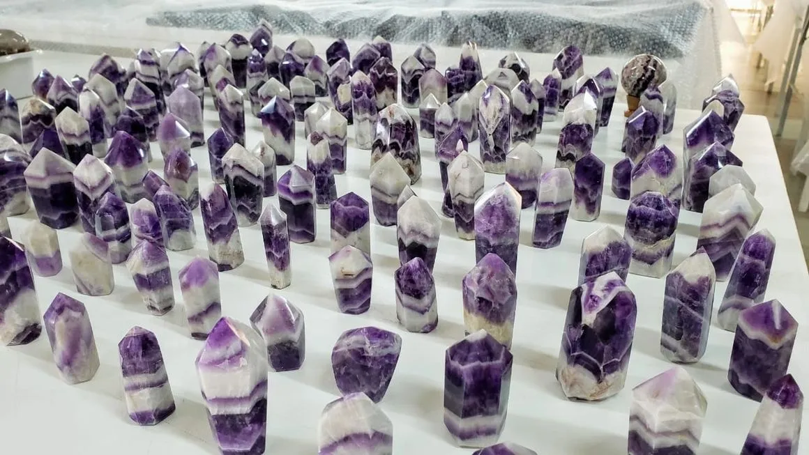 Purple and white crystal points on display.