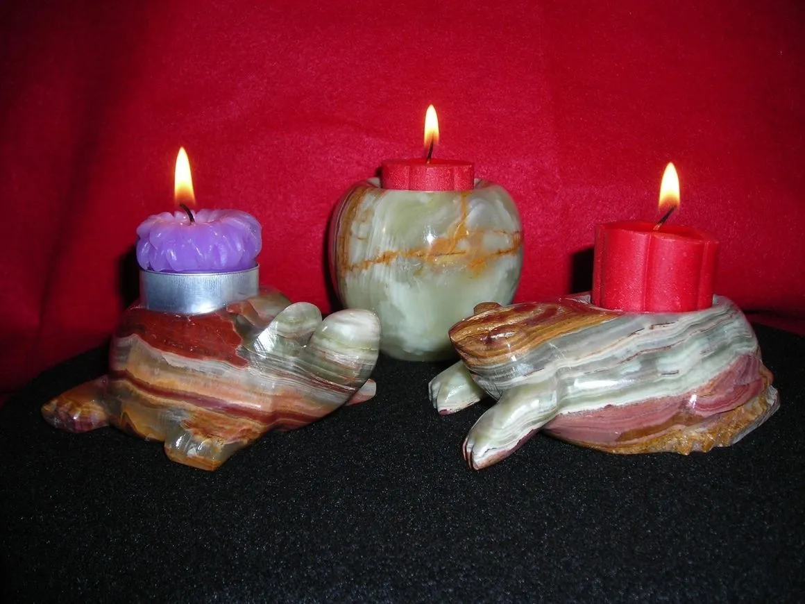 Stone candle holders with lit candles.