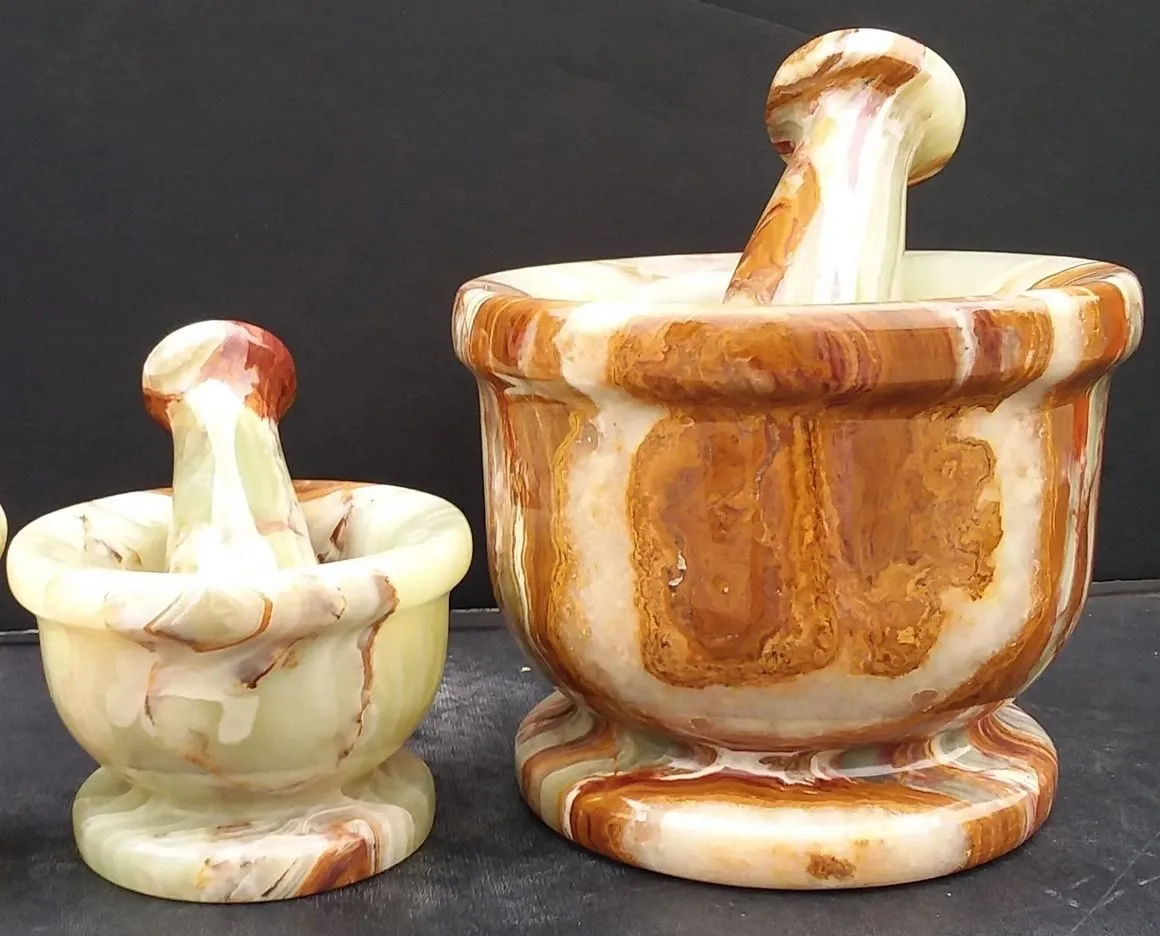 Two marble mortars with pestles.