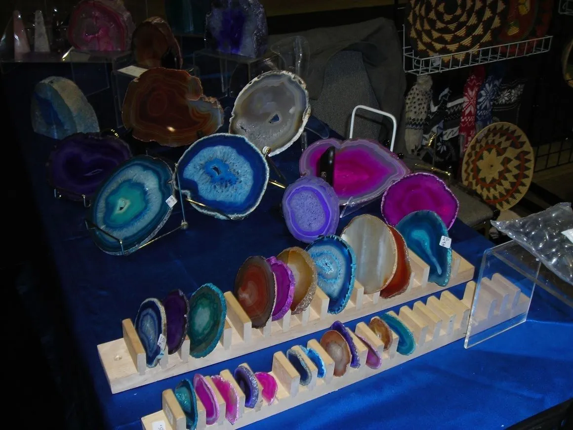 Colorful agate slices displayed on a table.