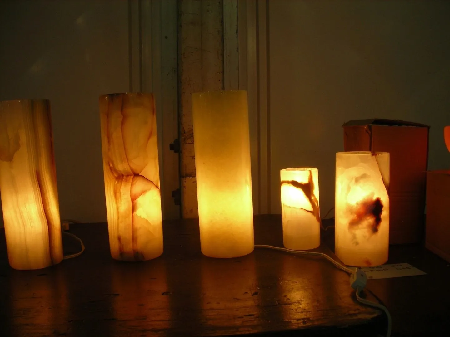 Glowing stone lamps on a dark surface.