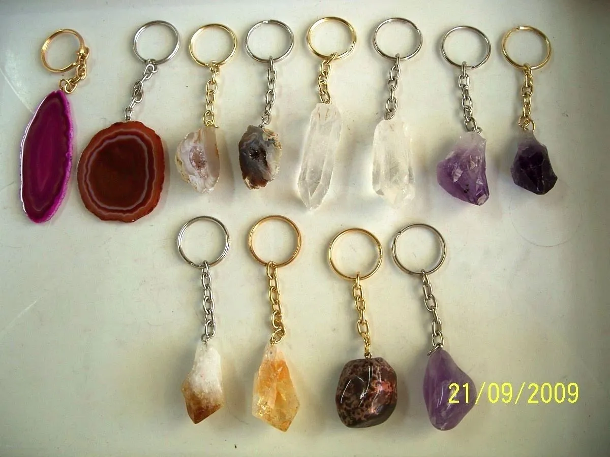 Crystal keychains displayed on a white surface.